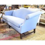 A mahogany three seater camel back settee, with light blue upholstery