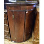 A George III mahogany bow front hanging corner cupboard, 75 cm wide