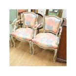 A pair of Continental painted and carved wood upholstered armchairs (2)