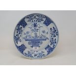 A Chinese porcelain bowl, decorated flowers in a basket in underglaze blue, 30 cm diameter Report by