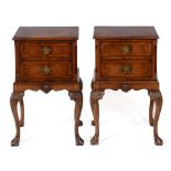 A pair of walnut bedside chests, in the 18th century taste, crossbanded, each having two long