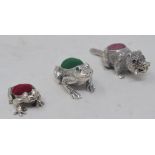 A novelty silver pincushion, in the form of a beaver, 1.5 cm high, and two other miniature
