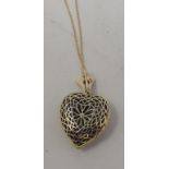 A 9ct gold, sapphire and diamond heart shape locket/pendant, decorated a fleur de lys, on a 9ct gold