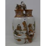 A Japanese Kutani double vase, applied and painted figures, damaged, 31 cm high Report by NG Left