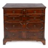 An 18th century oak chest, of four graduated long drawers, on bracket feet, 99 cm wide See