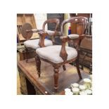 A pair of mahogany balloon back carver chairs (2)