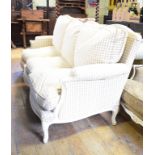 A French three seater settee, with feather cushions and painted wood frame