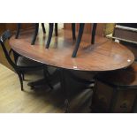 A mahogany oval dining table, on splay legs, 177 cm wide