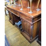 A Victorian mahogany sideboard, having three frieze drawers above a pair of panel doors, 183 cm wide