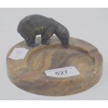 An Art Deco ashtray, applied a bronze polar bear, 12 cm diameter