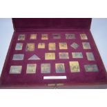 The Empire Collection: a set of 25 silver gilt facsimile stamps, boxed