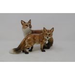 A Hutschenreuther group, of two foxes, ear chips, 7 cm high, other animals, and two Worcester