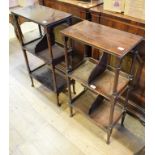 A matched pair of early 20th century mahogany three tier book stands, on turned supports, 48 and