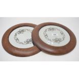 A pair of etched mirror roundels, in oak frames, 27.5 cm diameter (2)