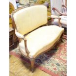 A Louis XVI style walnut two seater settee, on cabriole front legs