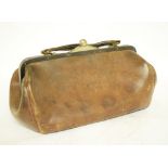 A leather Gladstone bag, 30 cm wide, another and three handbags (5)