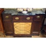 A Regency style breakfront mahogany side cabinet, the green marble top with a brass three quarter