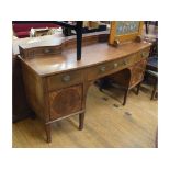 An inlaid mahogany bow front sideboard, crossbanded, on tapering square legs, 177 cm wide