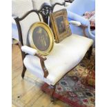 An Edwardian two seater settee, on cabriole front legs