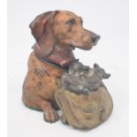 A novelty cold painted bronze inkwell, in the form of a dog and puppy, 12.5 cm high