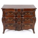 A Continental elm and oak three drawer commode, with carved decoration, 99 cm wide See illustration