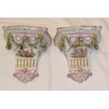 A pair of Meissen style porcelain wall brackets, decorated figures and foliage, 22.5 cm high (2)