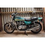 A 1976 Kawasaki Z900, registration number LBP 652P, green/gold/black. The big Zs first broke cover