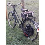A 1951 Cyclemaster, registration number LFF 636, green. This Cyclemaster has been fitted to a