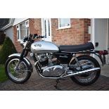 A 1972 Norton Commando 750 Interstate, registration number FAA 72K, silver. This matching frame