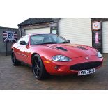 A 1998 Jaguar XKR coupé, registration number HUI 7964, chassis number SAJJGAEF3AR026725, engine