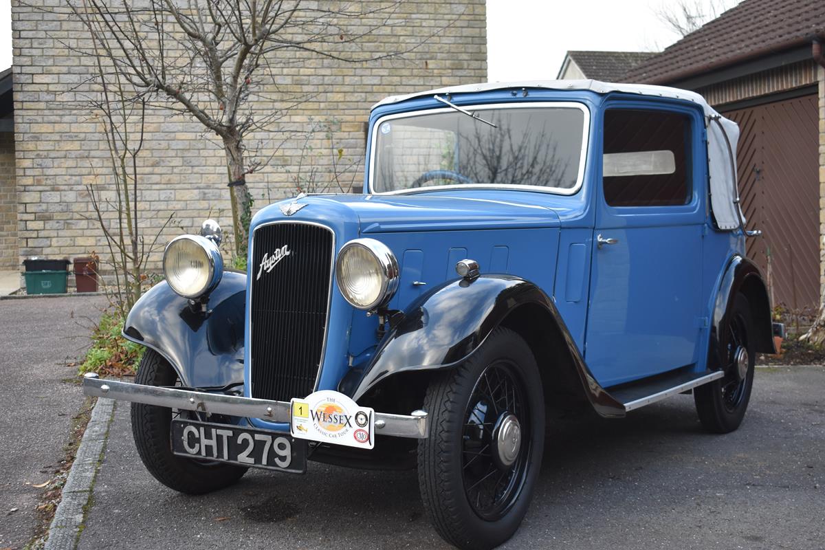 A 1936 Austin 10/4 Colwyn cabriolet, registration number CHT 279, chassis number 82329, blue over