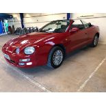 A 1996 Toyota Celica convertible, registration number N658 BRD, red. This rare convertible was