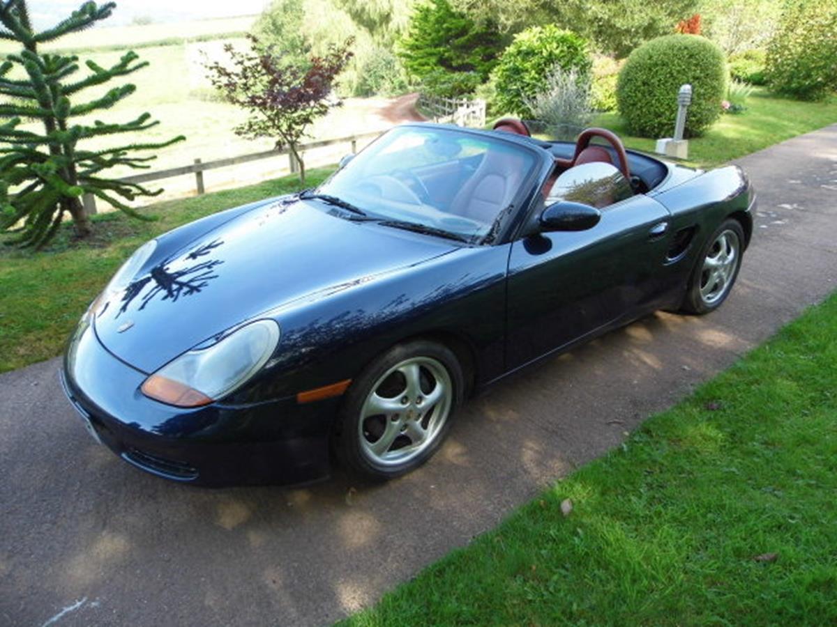 A 1998 Porsche Boxster, registration number R315 JPF, blue. This early Boxster has a manual gearbox,