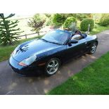 A 1998 Porsche Boxster, registration number R315 JPF, blue. This early Boxster has a manual gearbox,