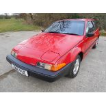 A 1992 Volvo 480, registration number J386 PUE, red. The Volvo 480 is becoming a rare sight on