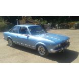 A 1975 Fiat 124 coupé, registration number N920 PTL, metallic light blue. This extremely original