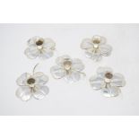 A set of five Swedish silver coloured metal candle holders, in the form of flowerheads, 8 cm wide,