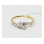 An 18ct gold, platinum and diamond crossover ring, approx. ring size S½ Report by NG With a