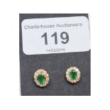 A pair of emerald and diamond cluster stud earrings, in yellow coloured metal mounts