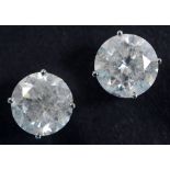 A pair of large diamond stud earrings, the modern brilliant cut stones set in white coloured metal