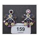 A pair of silver gem set chandelier earrings Report by NG Modern