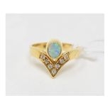 An opal and diamond ring, in a yellow coloured metal mount, approx. ring size N Approx. 5.0 g (all