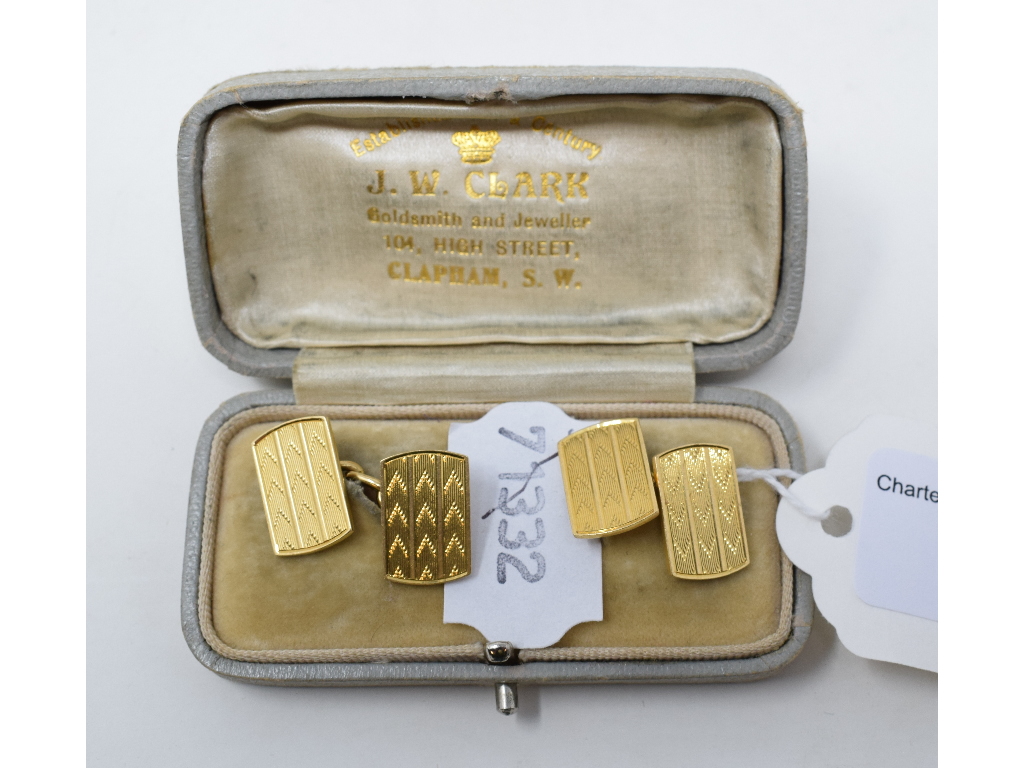 A pair of 18ct gold cufflinks, of rectangular form with engine turned decoration, approx. 12.0 g,