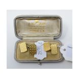 A pair of 18ct gold cufflinks, of rectangular form with engine turned decoration, approx. 12.0 g,