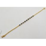 An 18ct gold, sapphire and diamond bracelet Report by NG It is approx. 7.8 g