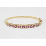 A yellow coloured metal, pink spinel and diamond bangle Report by NG Metal is untested but suspect
