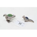 A novelty silver pincushion, in the form of a pheasant, 3.5 cm high, and another (2) Report by NG