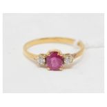 An 18ct gold, ruby and diamond three stone ring, approx. ring size M