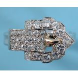 A platinum buckle ring, set diamonds, approx. ring size S½ See illustration Approx. 8.9 g (all in)