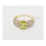 A 10ct gold and peridot dress ring, approx. ring size L Report by NG It is approx. 2.6 g (all in)